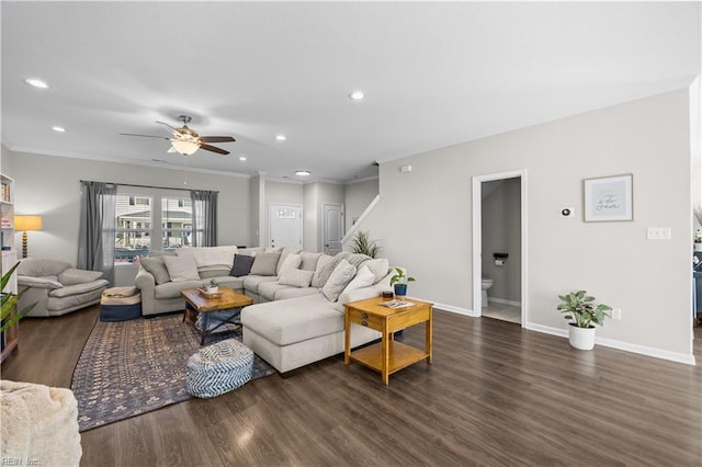 living area with ornamental molding, recessed lighting, dark wood finished floors, and baseboards