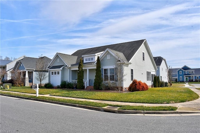 view of front of home featuring a residential view and a front lawn