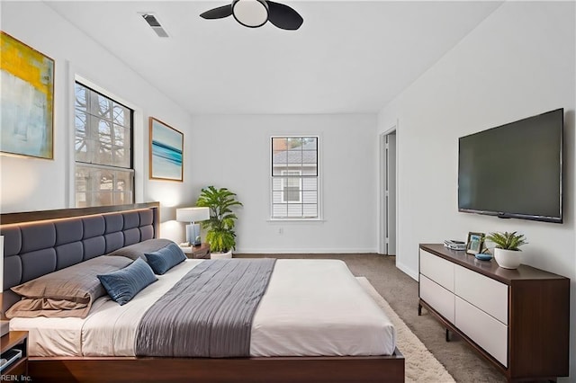 bedroom with baseboards, carpet flooring, and visible vents