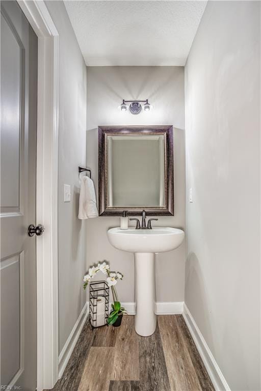 bathroom featuring hardwood / wood-style flooring and sink