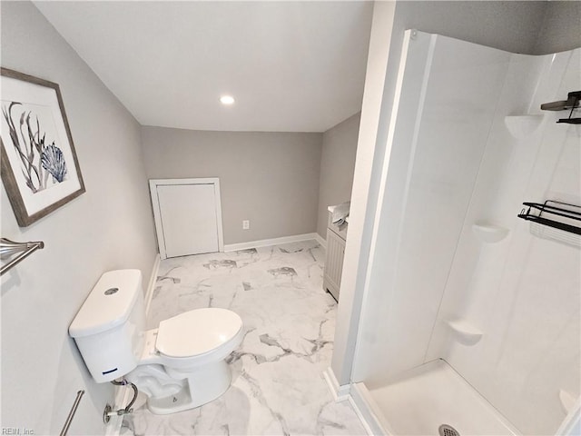 bathroom featuring toilet, marble finish floor, a shower stall, and baseboards