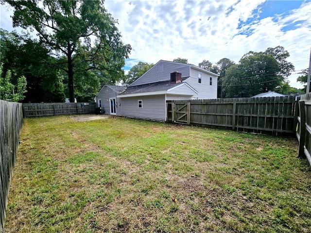 view of yard with a fenced backyard