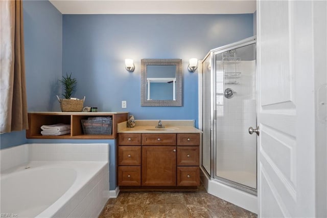 bathroom with a bath, a shower stall, and vanity