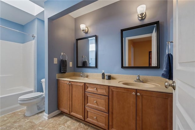 full bath featuring shower / bathtub combination, double vanity, a sink, and toilet