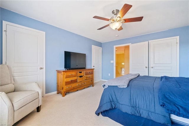 bedroom featuring light carpet, ceiling fan, and baseboards