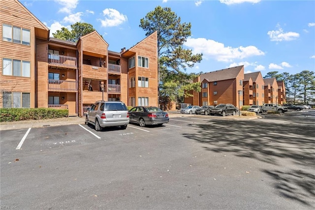 view of property featuring uncovered parking