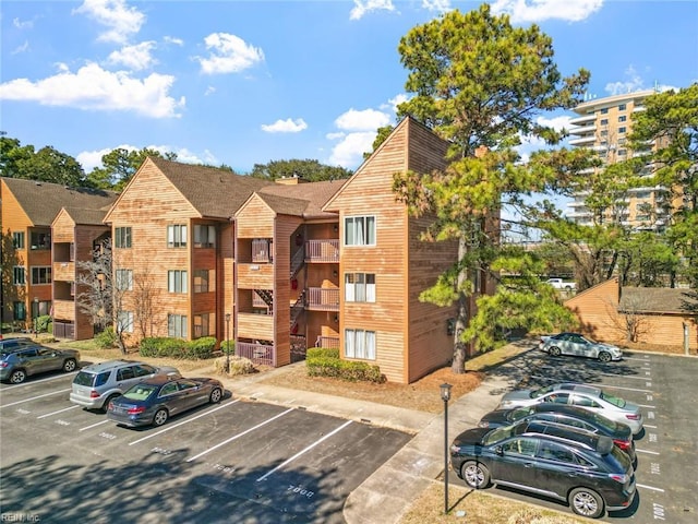 view of property featuring uncovered parking