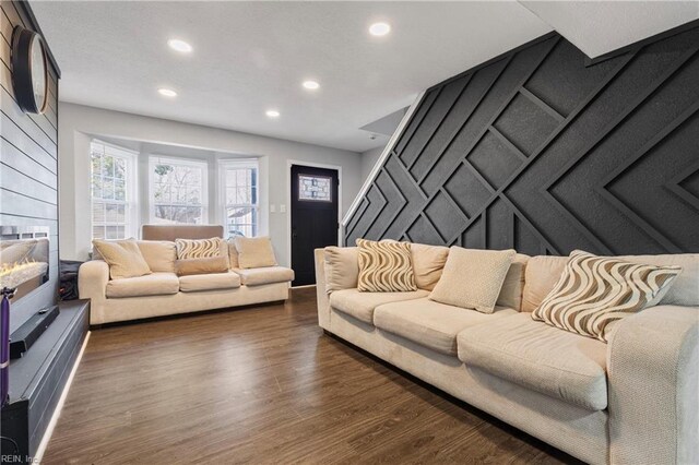 living area featuring dark wood-type flooring and recessed lighting