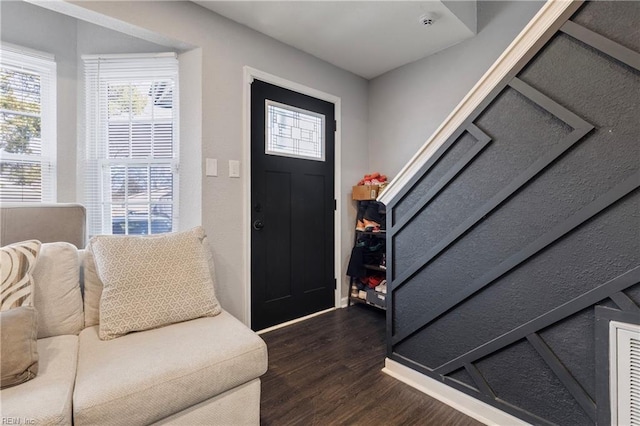 entrance foyer featuring dark wood-type flooring