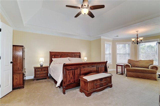 bedroom featuring light colored carpet, ceiling fan with notable chandelier, baseboards, ornamental molding, and a raised ceiling