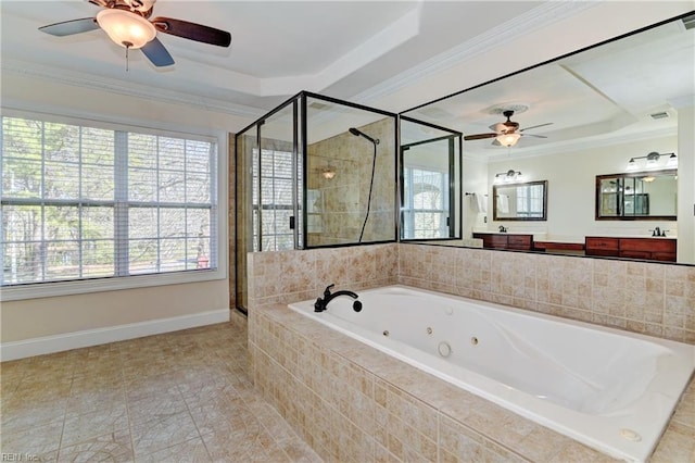 full bathroom featuring a stall shower, a jetted tub, vanity, and crown molding