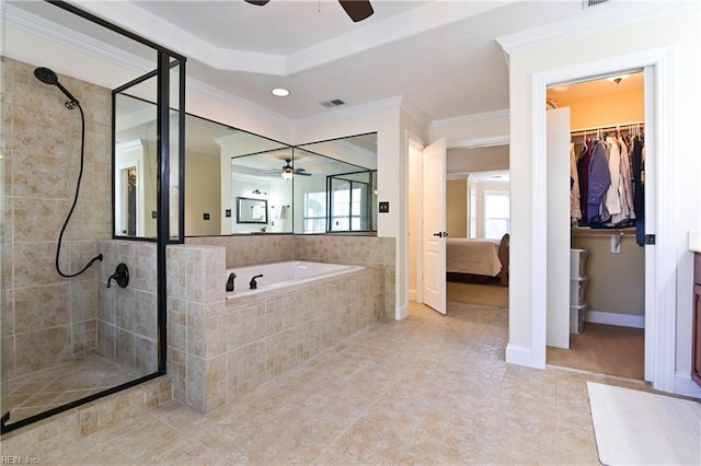 full bath featuring a walk in closet, crown molding, a shower stall, vanity, and a bath