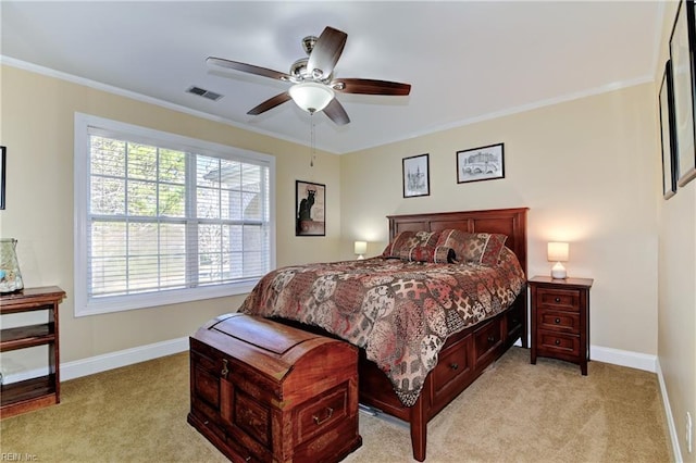 bedroom featuring light carpet, visible vents, and crown molding