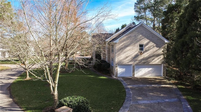 view of side of property featuring a garage, brick siding, concrete driveway, and a yard