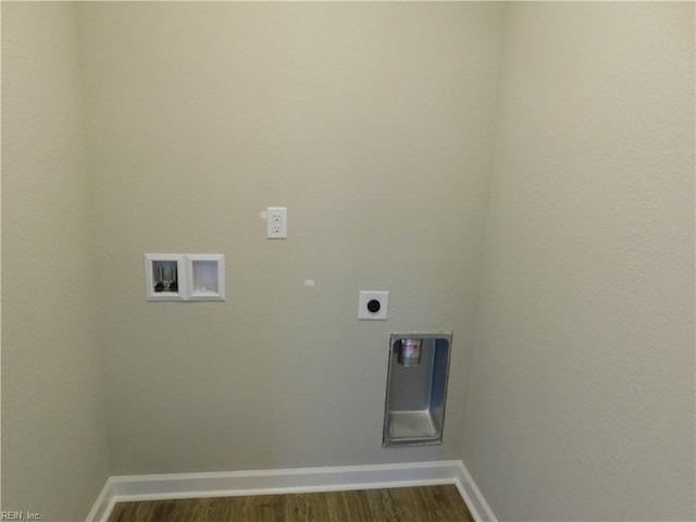 washroom featuring washer hookup, dark wood finished floors, hookup for an electric dryer, laundry area, and baseboards