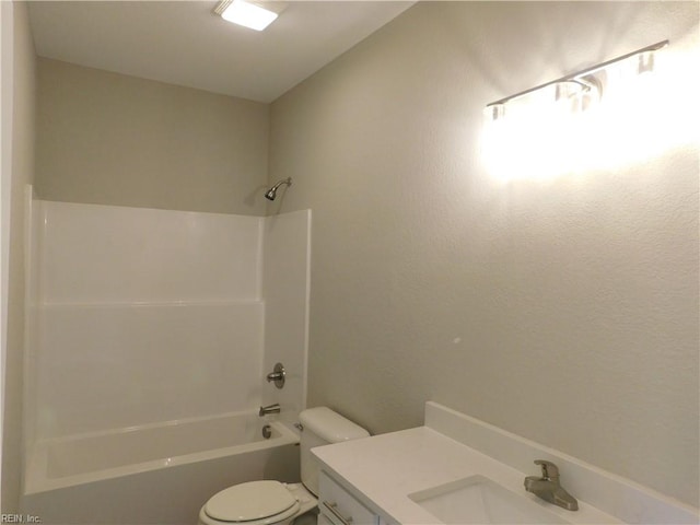 bathroom with vanity, bathtub / shower combination, and toilet