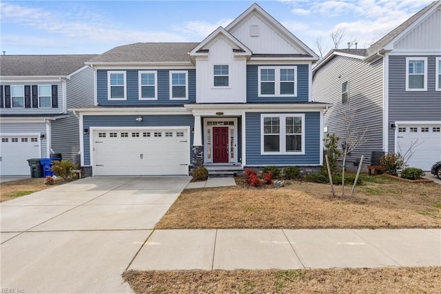 craftsman-style house with a garage, driveway, and board and batten siding