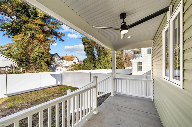 exterior space with ceiling fan