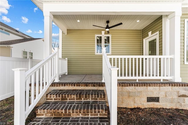 property entrance featuring covered porch and ceiling fan