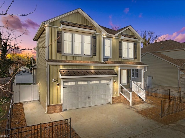 traditional home with a garage, brick siding, fence, concrete driveway, and board and batten siding