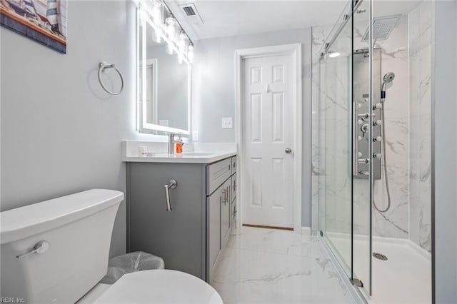 full bathroom with marble finish floor, vanity, a marble finish shower, and toilet