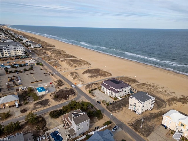 birds eye view of property with a view of the beach and a water view