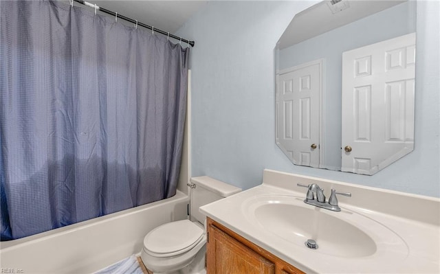 full bathroom with shower / bath combo, vanity, and toilet