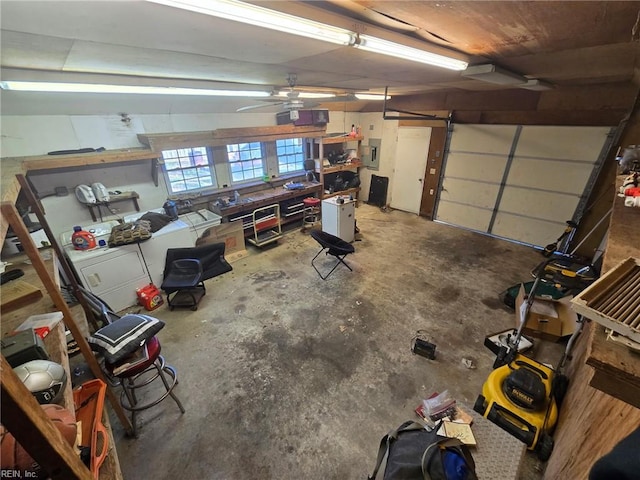 garage with electric panel and a ceiling fan