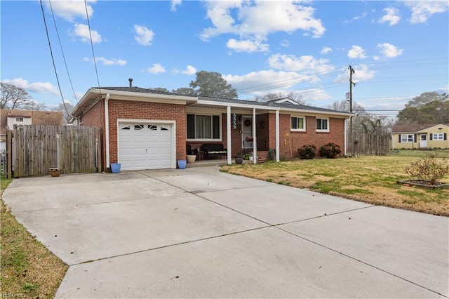 ranch-style home with brick siding, an attached garage, a front lawn, fence, and driveway