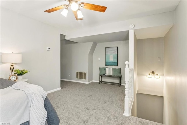 bedroom with a ceiling fan, light colored carpet, visible vents, and baseboards