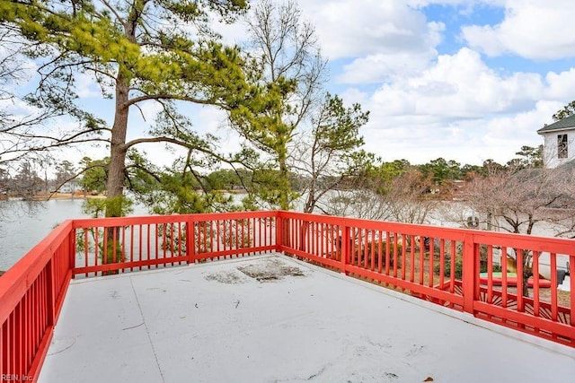 wooden deck with a water view