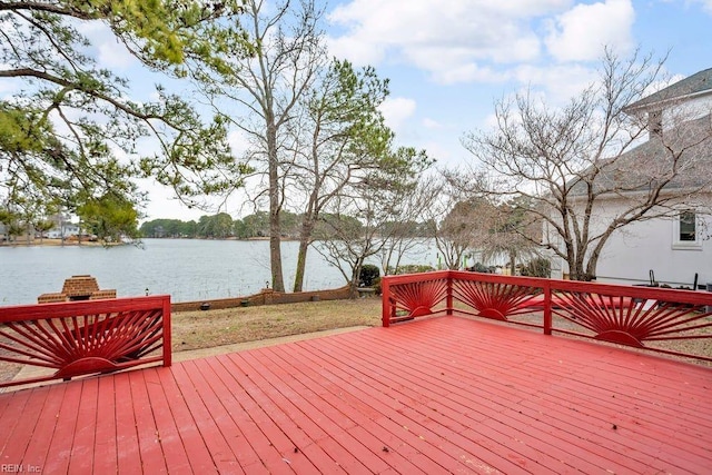 wooden terrace featuring a water view