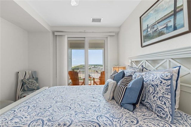 bedroom featuring access to outside and visible vents