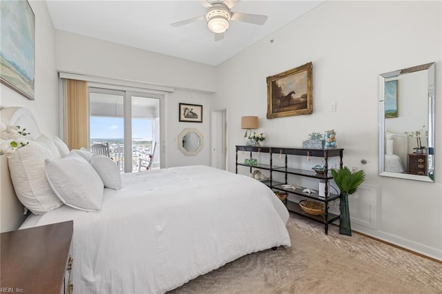 bedroom with access to outside, a ceiling fan, and baseboards