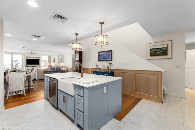 kitchen with marble finish floor, visible vents, pendant lighting, and light countertops