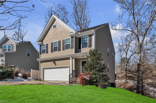 view of front of property with driveway, an attached garage, fence, and a front yard