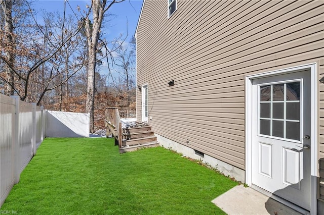 view of yard with a fenced backyard