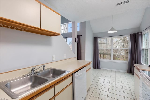 kitchen with white appliances, white cabinetry, pendant lighting, and light countertops