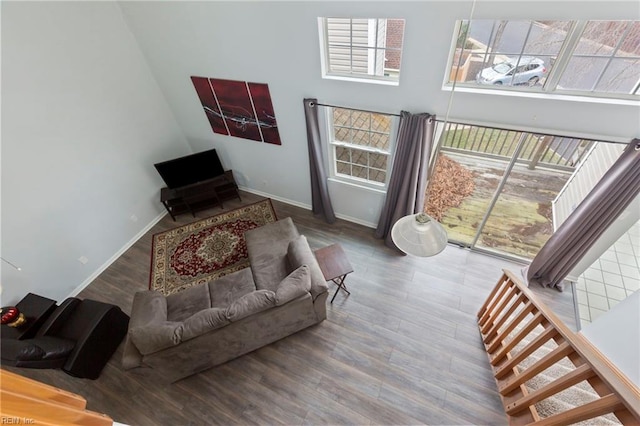 living room with a wealth of natural light and wood finished floors