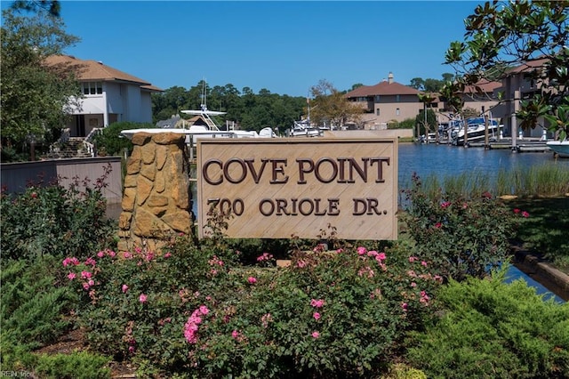 community sign with a water view