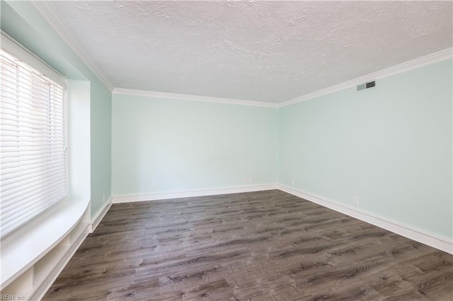 unfurnished room featuring crown molding, visible vents, dark wood finished floors, and a textured ceiling