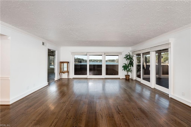 unfurnished living room featuring ornamental molding, dark wood-type flooring, and a textured ceiling