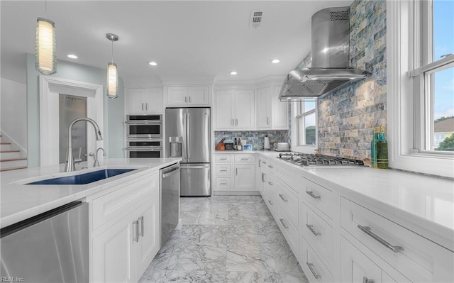 kitchen with visible vents, appliances with stainless steel finishes, marble finish floor, extractor fan, and a sink