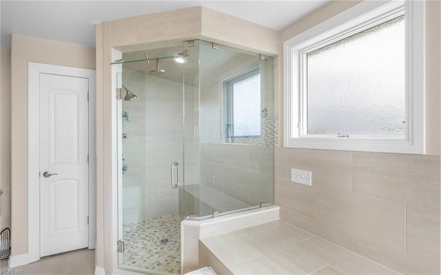 full bath featuring a shower stall