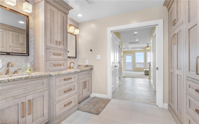 full bathroom featuring recessed lighting, a sink, tile patterned floors, double vanity, and tasteful backsplash