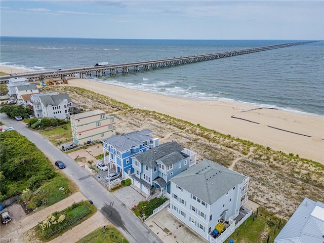 birds eye view of property with a view of the beach and a water view