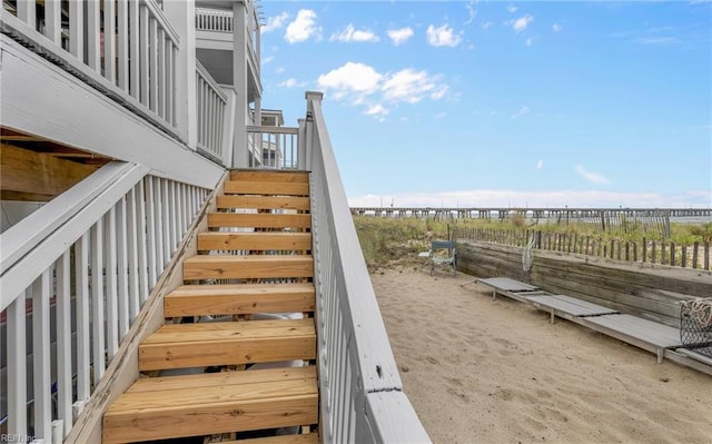 exterior space with fence and stairs