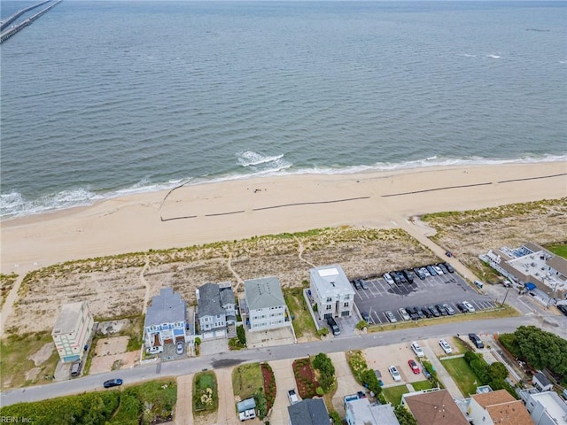 bird's eye view with a water view and a view of the beach