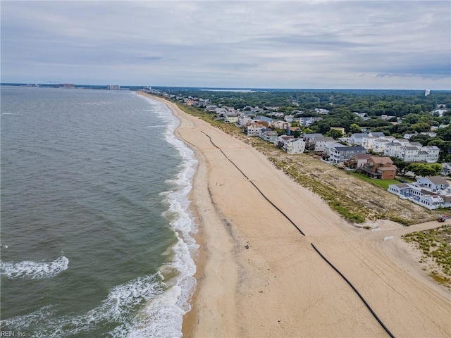 aerial view featuring a water view and a view of the beach