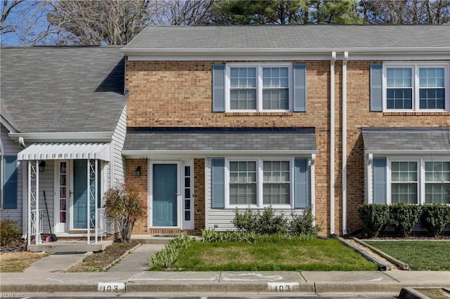 view of property with brick siding